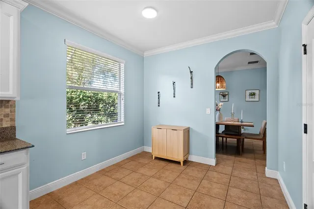 a kitchen with stainless steel appliances a refrigerator and a stove top oven