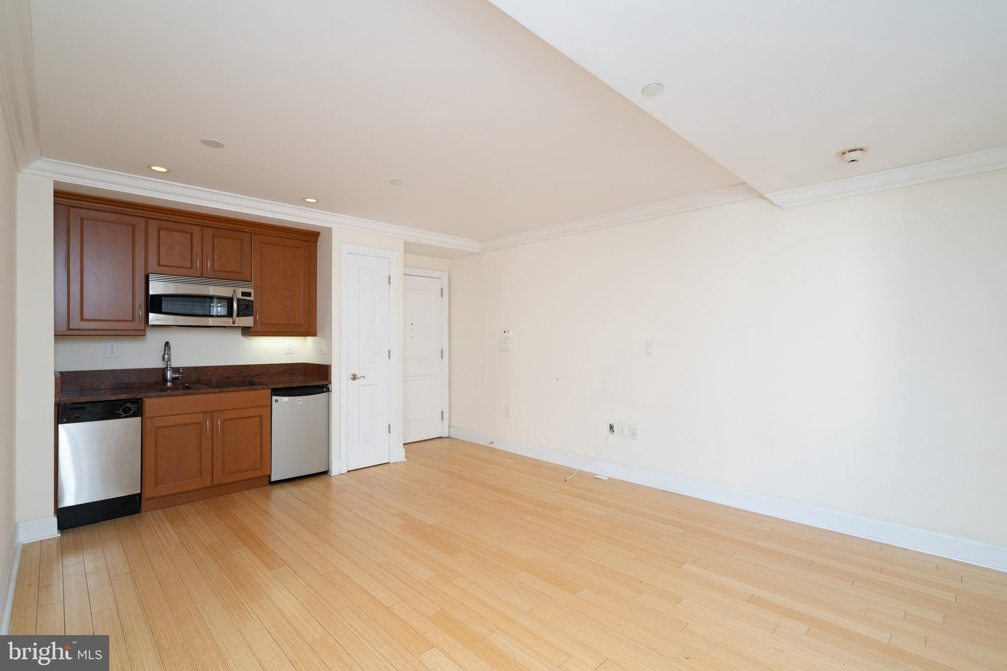 1701 Locust Street, Unit 1417 Philadelphia, PA 19103 - Photo 2 of 29 a kitchen with stainless steel appliances granite countertop a stove a sink and a refrigerator