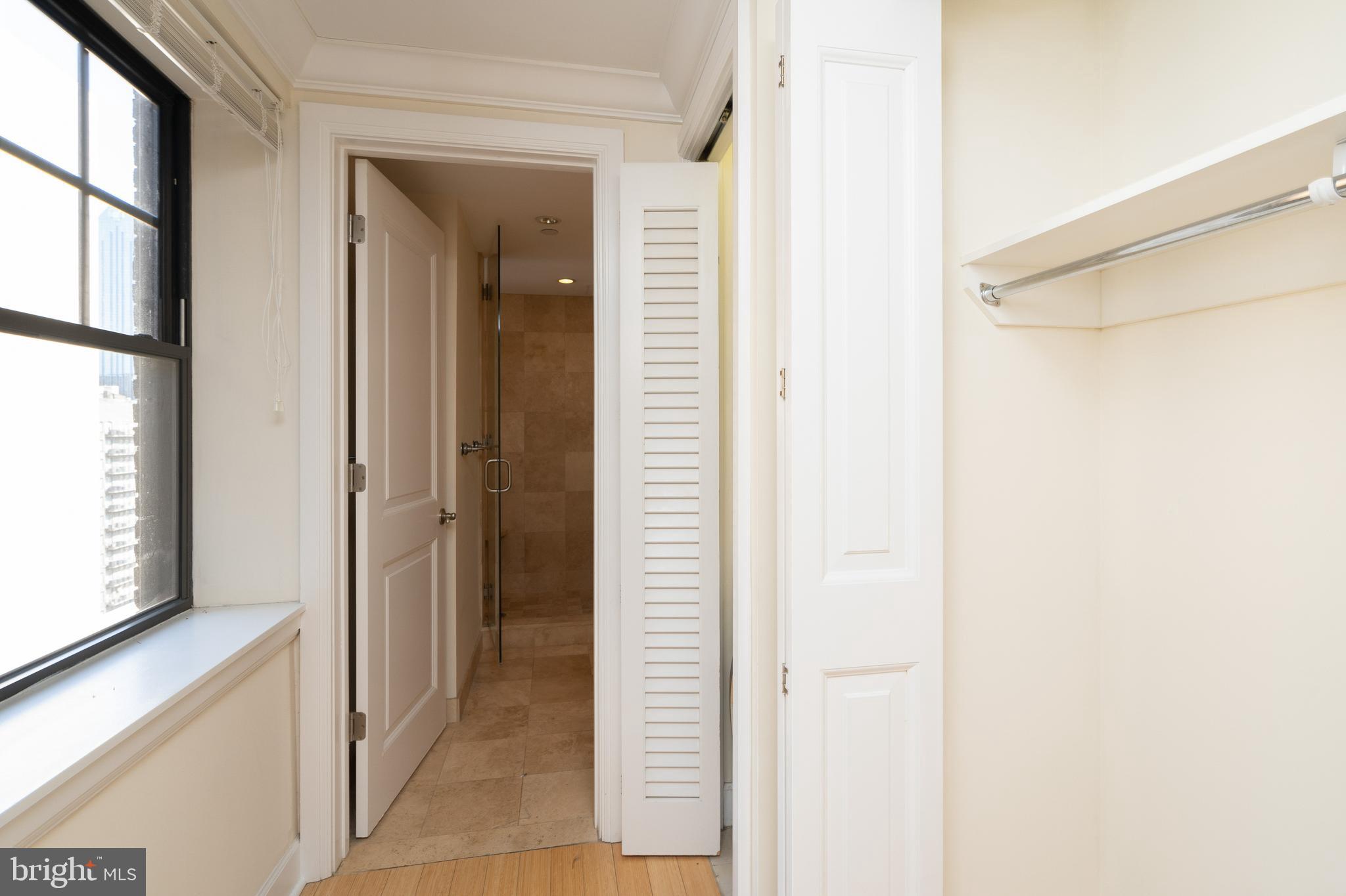 1701 Locust Street, Unit 1417 Philadelphia, PA 19103 - Photo 12 of 29 a view of a bathroom from a hallway