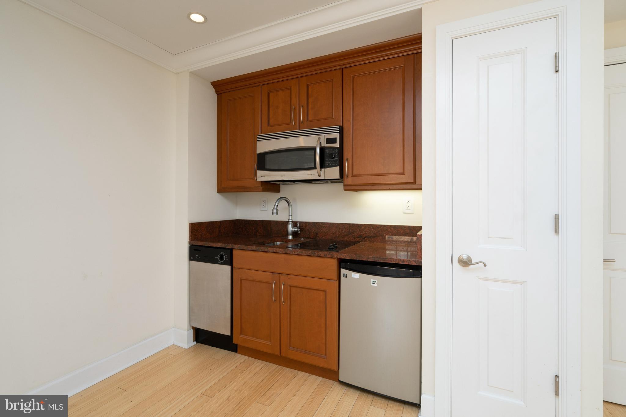 1701 Locust Street, Unit 1417 Philadelphia, PA 19103 - Photo 3 of 29 a kitchen with a sink and a microwave