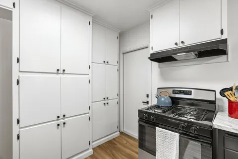 a kitchen with stainless steel appliances a stove and a refrigerator