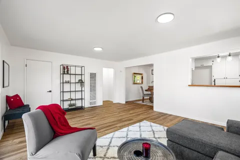 a bedroom with a bed and a couch