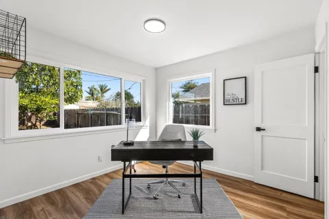 a workspace with furniture and a window