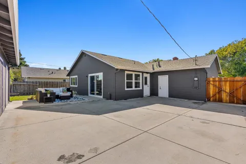 a patio with patio couch and table