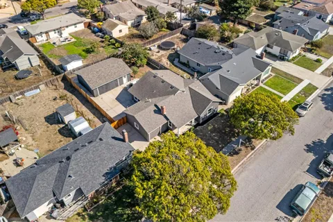 an aerial view of multiple houses with a outdoor space