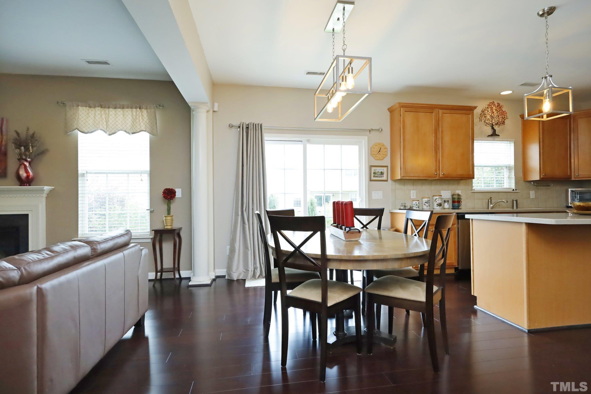 5325 Glass Ridge Road Raleigh, NC 27616 - Photo 12 of 42 a view of a dining room with furniture and wooden floor