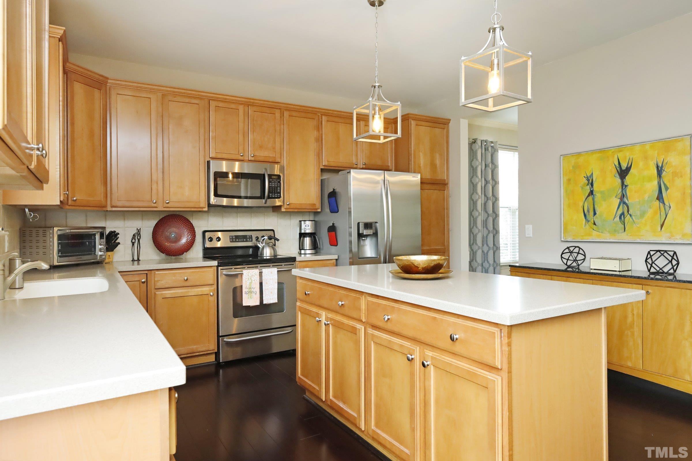 5325 Glass Ridge Road Raleigh, NC 27616 - Photo 16 of 42 a kitchen with stainless steel appliances and a refrigerator