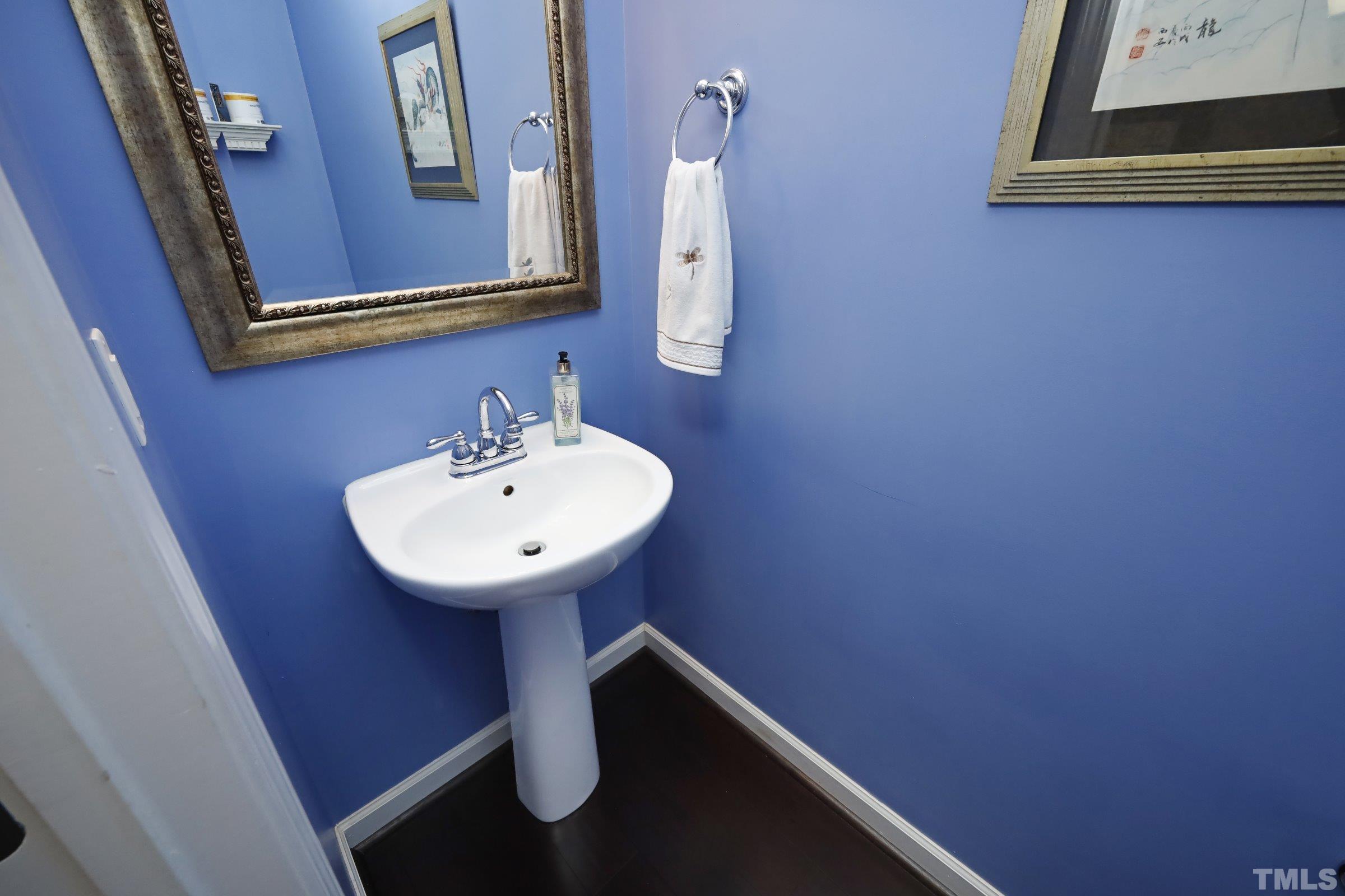 5325 Glass Ridge Road Raleigh, NC 27616 - Photo 19 of 42 a bathroom with a sink and a mirror