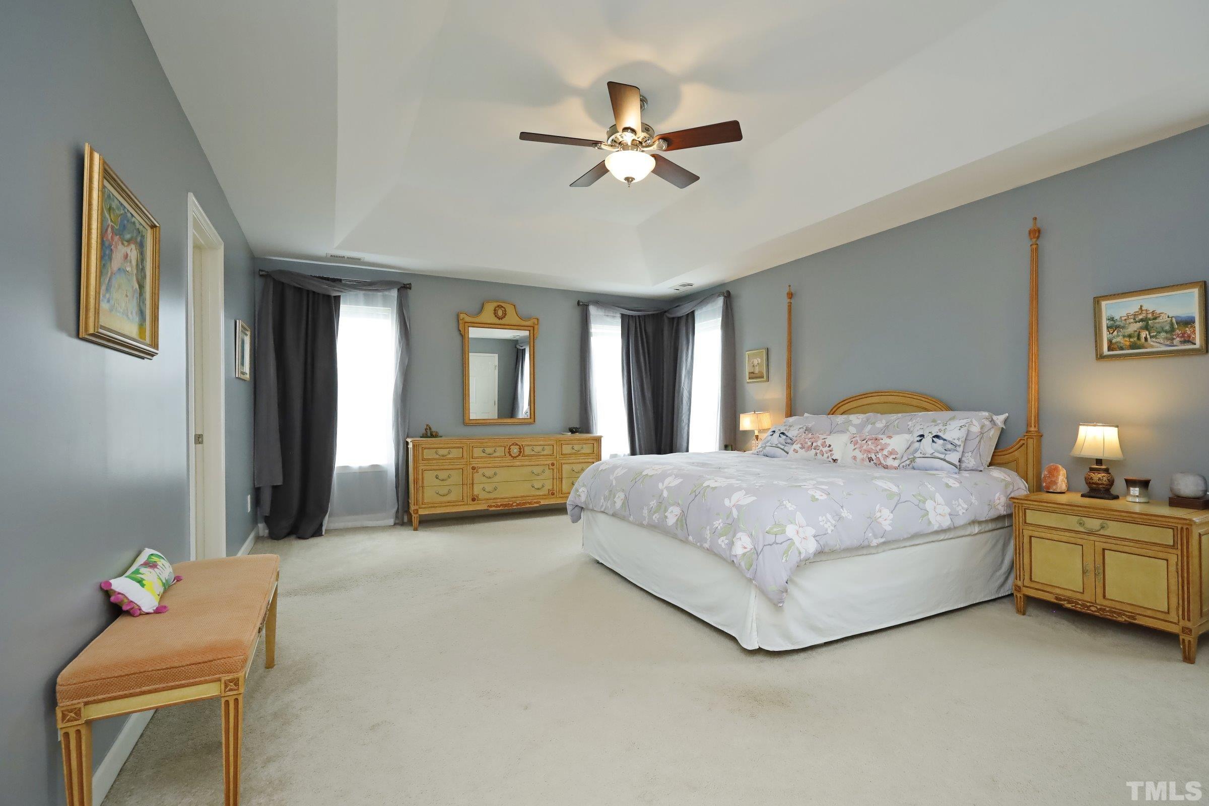5325 Glass Ridge Road Raleigh, NC 27616 - Photo 22 of 42 a bedroom with a bed and window