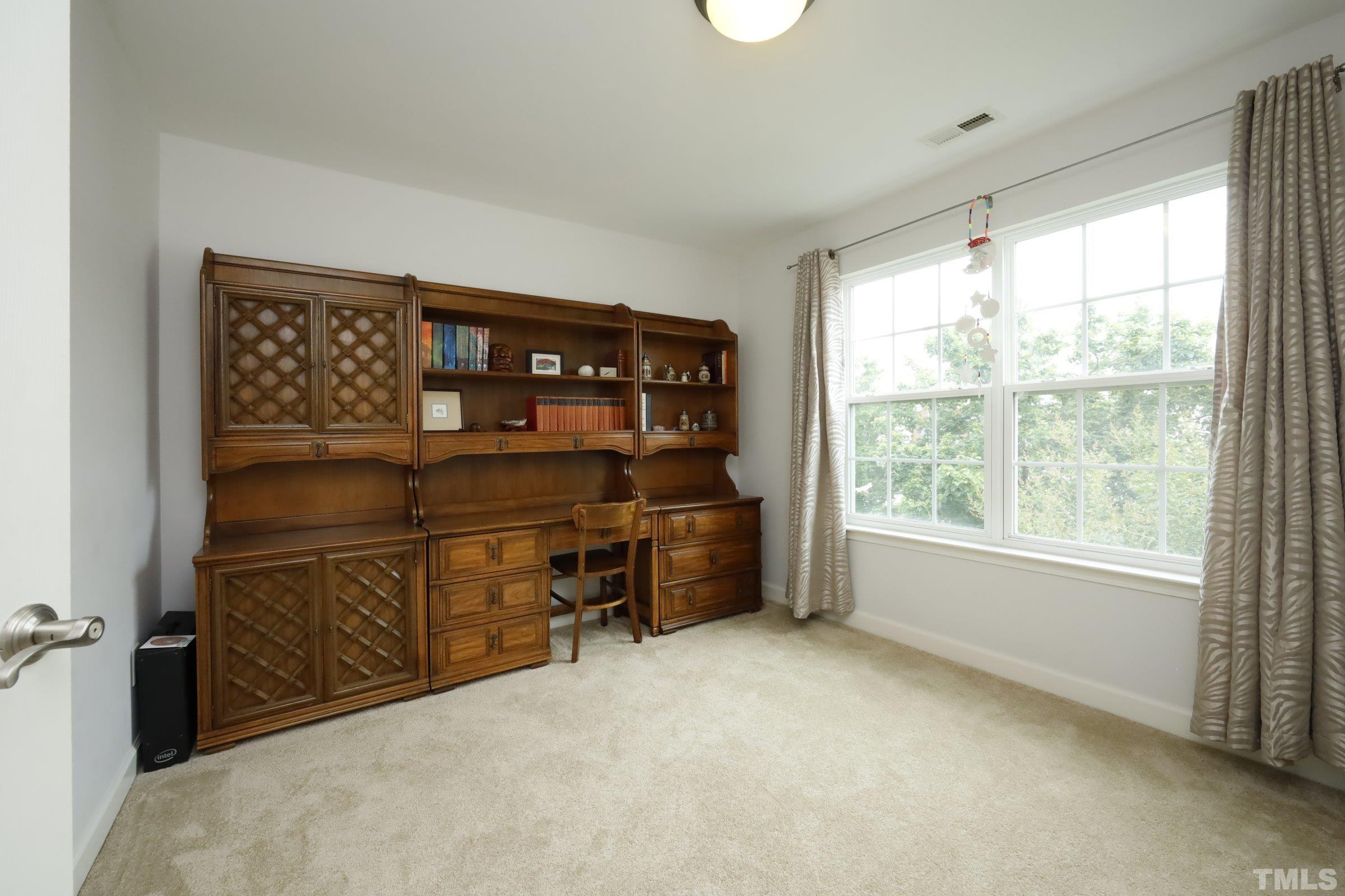 5325 Glass Ridge Road Raleigh, NC 27616 - Photo 33 of 42 an empty room with furniture and window