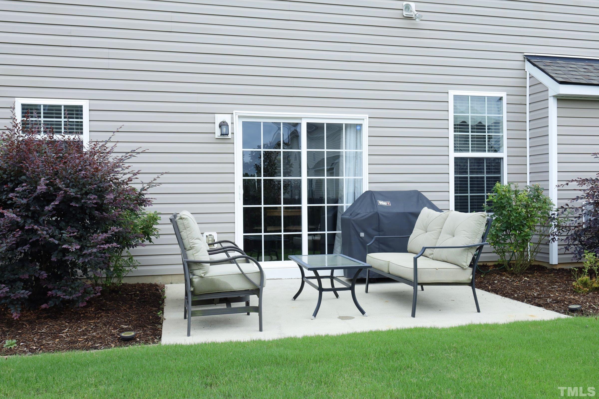 5325 Glass Ridge Road Raleigh, NC 27616 - Photo 39 of 42 a building outdoor space with couple sitting chairs