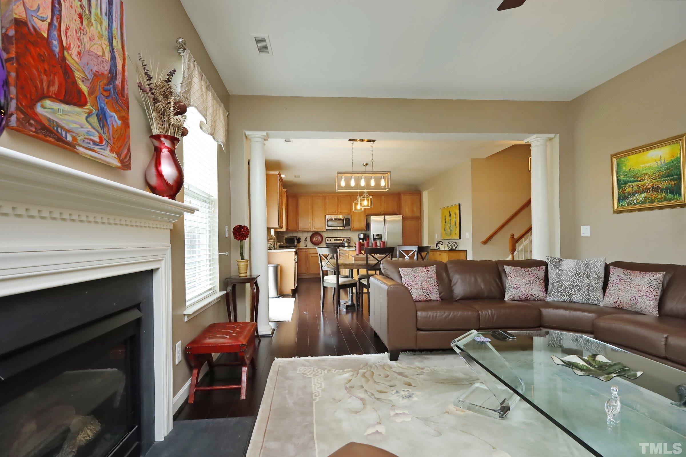 5325 Glass Ridge Road Raleigh, NC 27616 - Photo 10 of 42 a living room with furniture and a fireplace