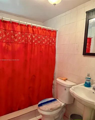 a bedroom with a bed and a cabinets