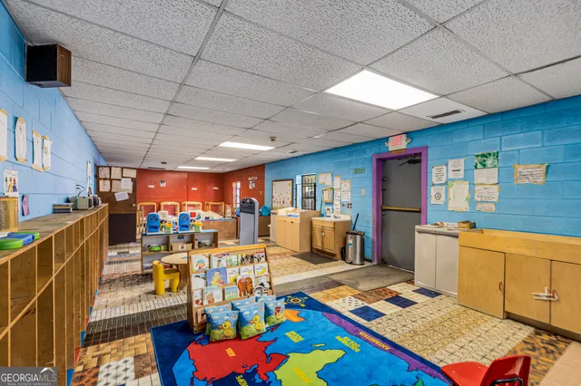 a outdoor space with lots of furniture and rug