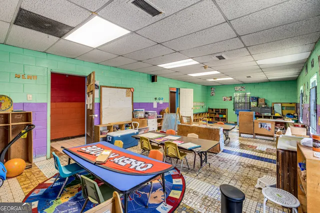 a room with lots of furniture and musical instruments