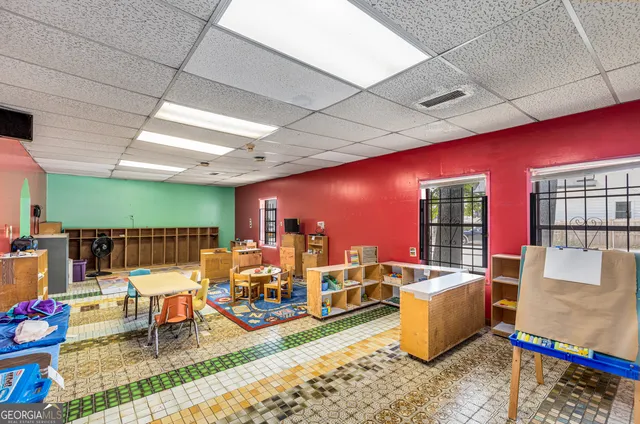 a living room with lots of furniture and a flat screen tv