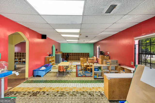 a very nice looking living room with furniture and a large window