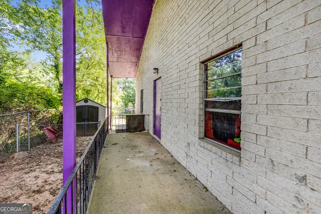 a view of a house with swimming pool and sitting area