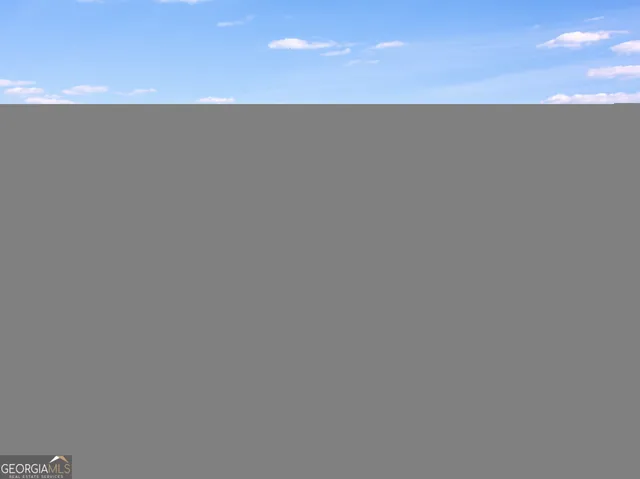 a view of a yard with an outdoor space