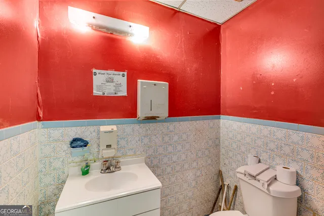 a bathroom with a sink and toilet
