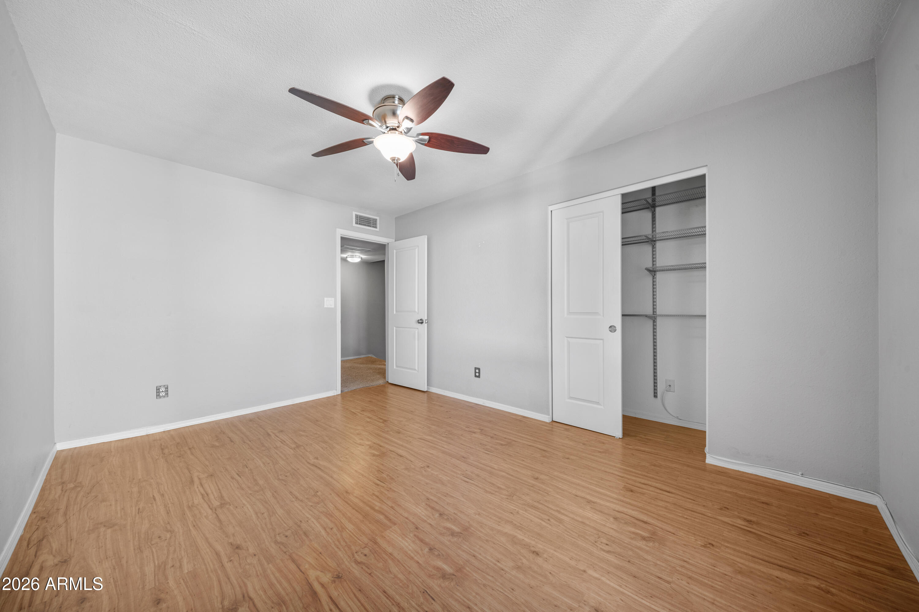 13230 North 3rd Way Phoenix, AZ 85022 - Photo 14 of 22 a view of an empty room with wooden floor