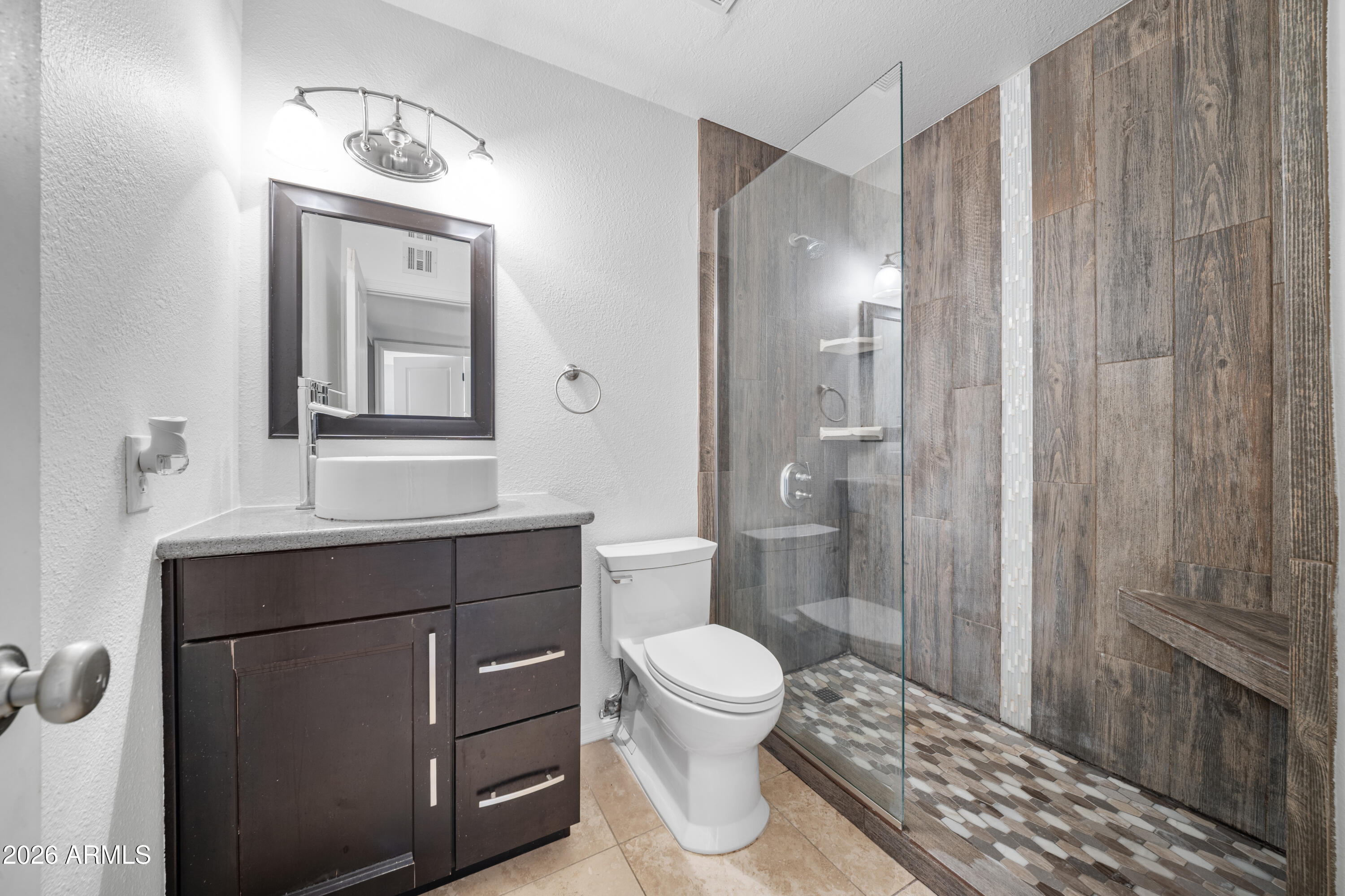13230 North 3rd Way Phoenix, AZ 85022 - Photo 15 of 22 a bathroom with a sink a toilet and shower