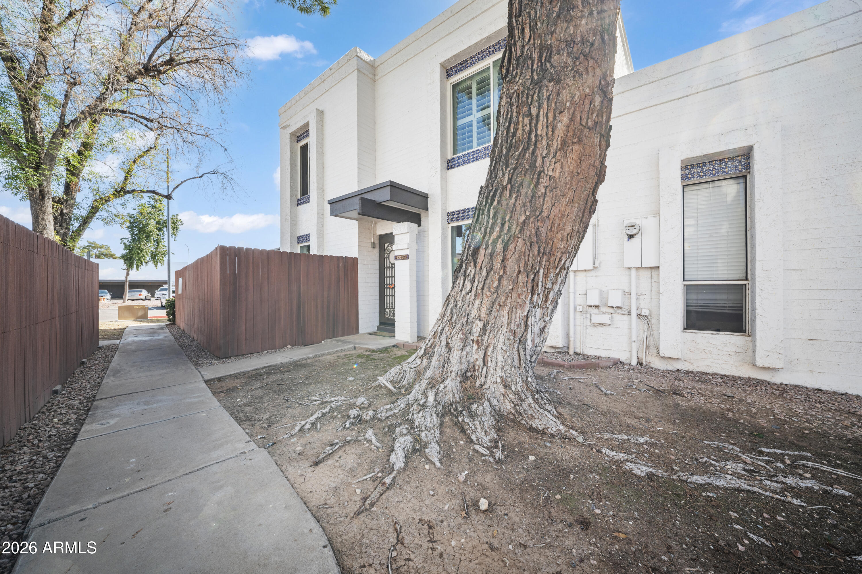 13230 North 3rd Way Phoenix, AZ 85022 - Photo 2 of 22 a view of white house with a tree