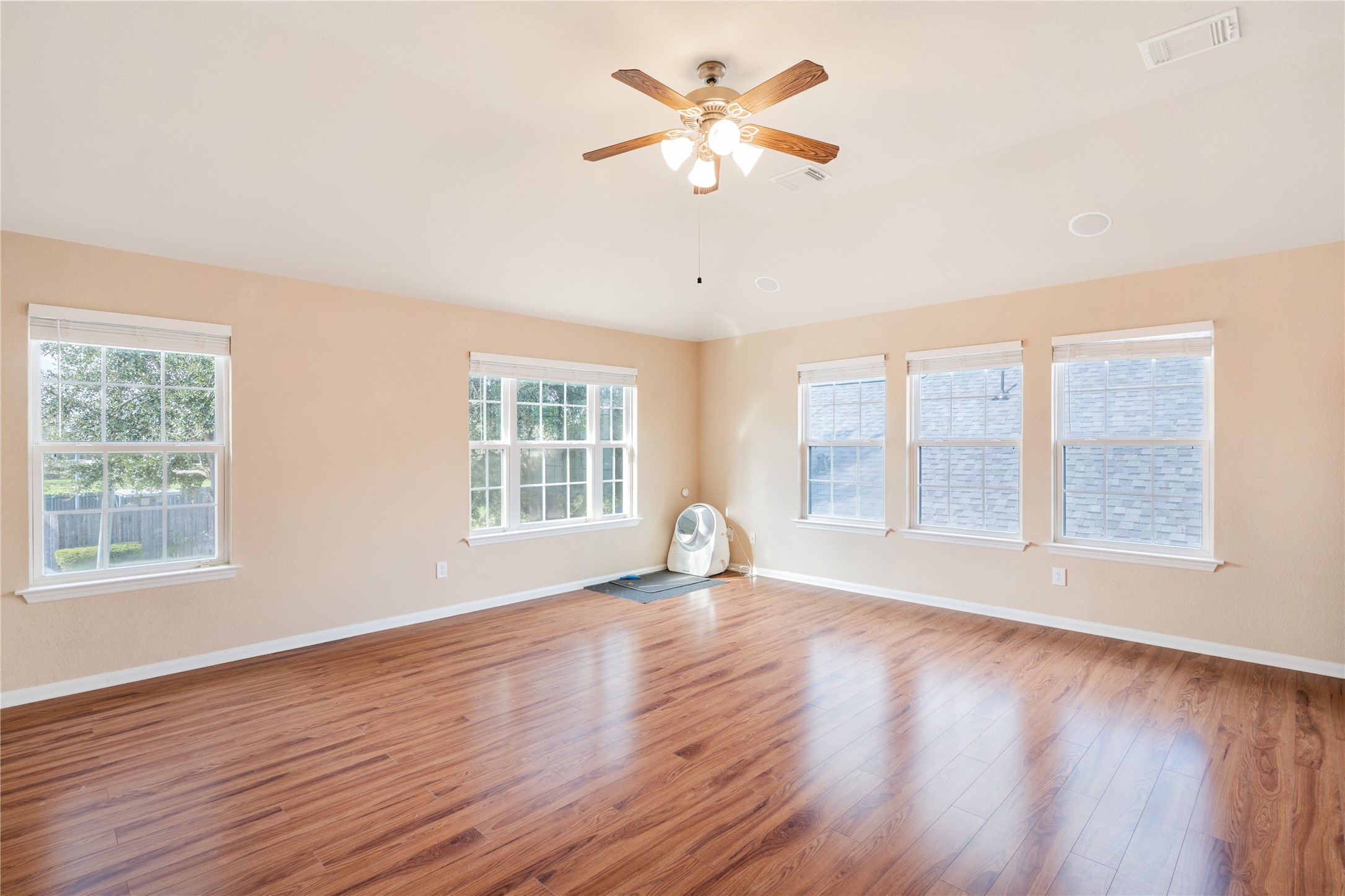 16622 Dover Mills Drive Spring, TX 77379 - Photo 14 of 20 a view of an empty room with wooden floor and a window