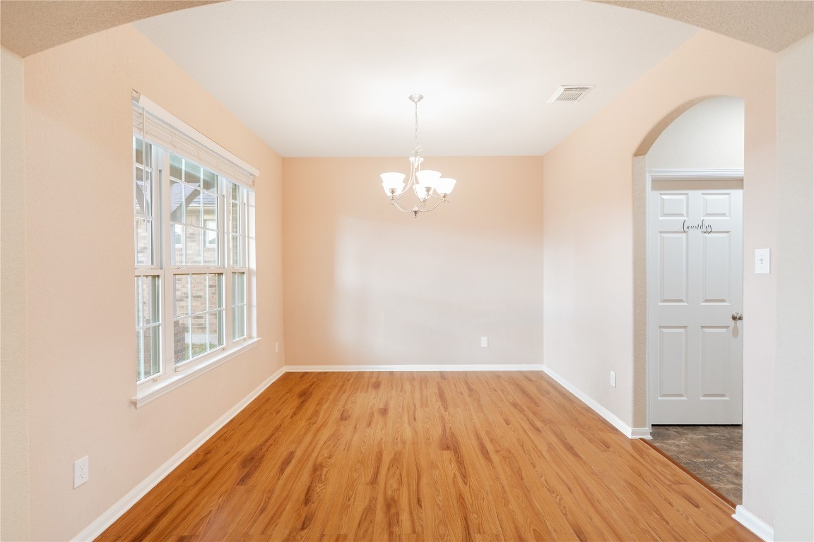 16622 Dover Mills Drive Spring, TX 77379 - Photo 2 of 20 a view of empty room with wooden floor and fan