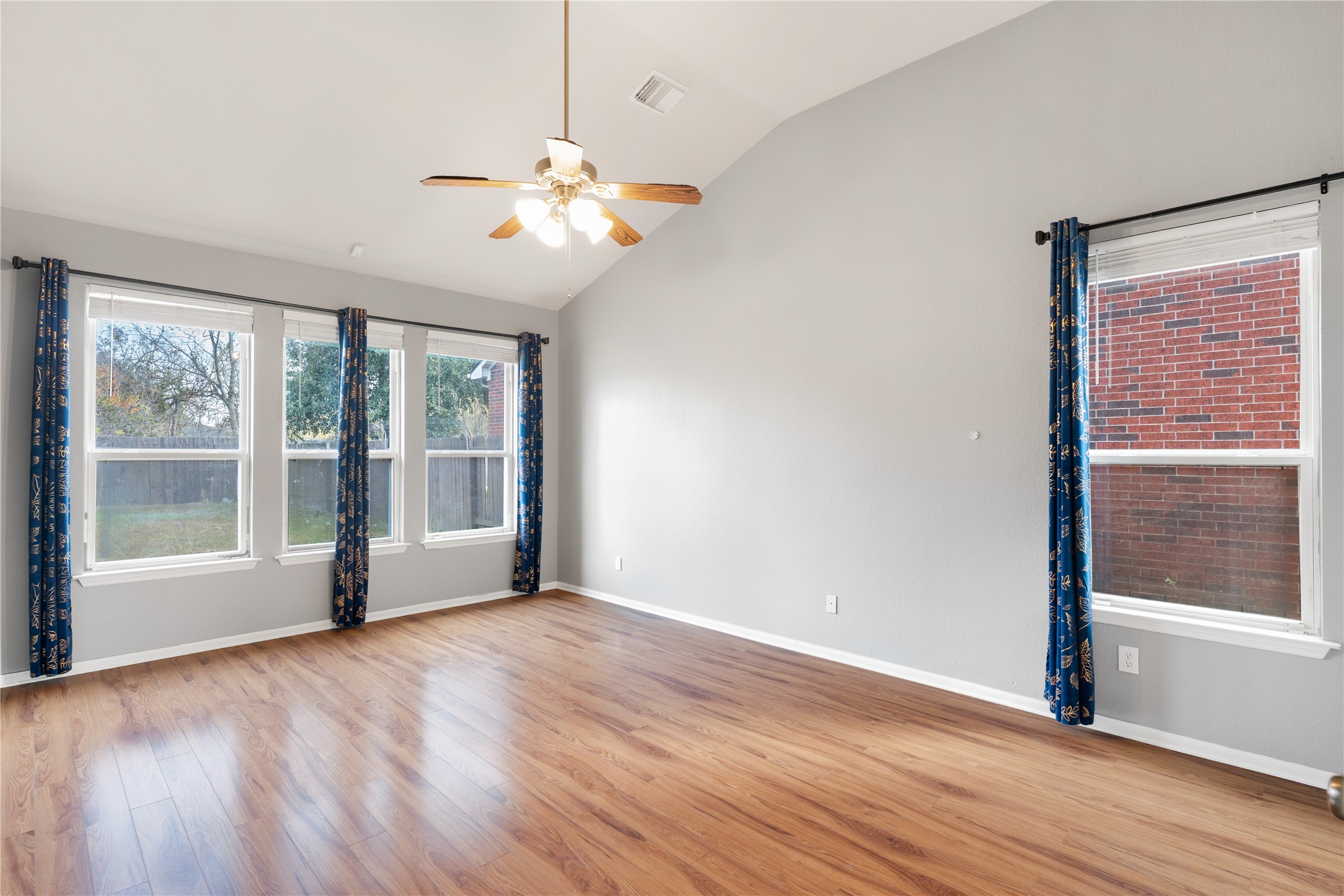 16622 Dover Mills Drive Spring, TX 77379 - Photo 8 of 20 a view of an empty room with wooden floor and a window