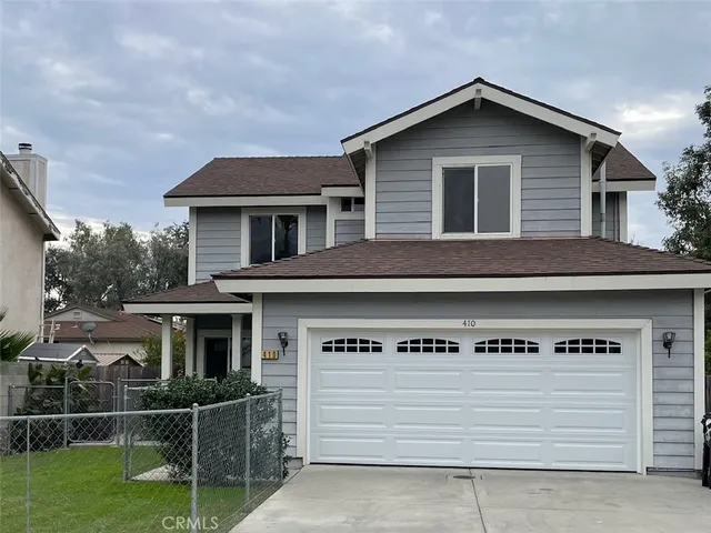 a front view of a house with garage
