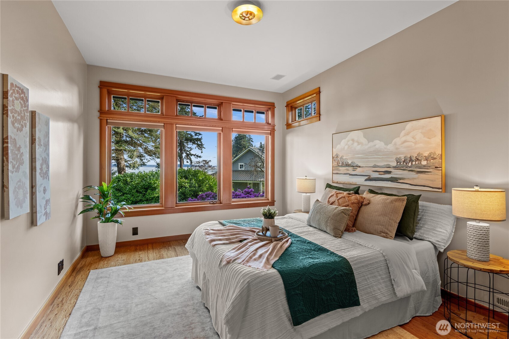 33244 Eglon Road Northeast Kingston, WA 98346 - Photo 17 of 40 a bedroom with a bed and a lamp next to a window