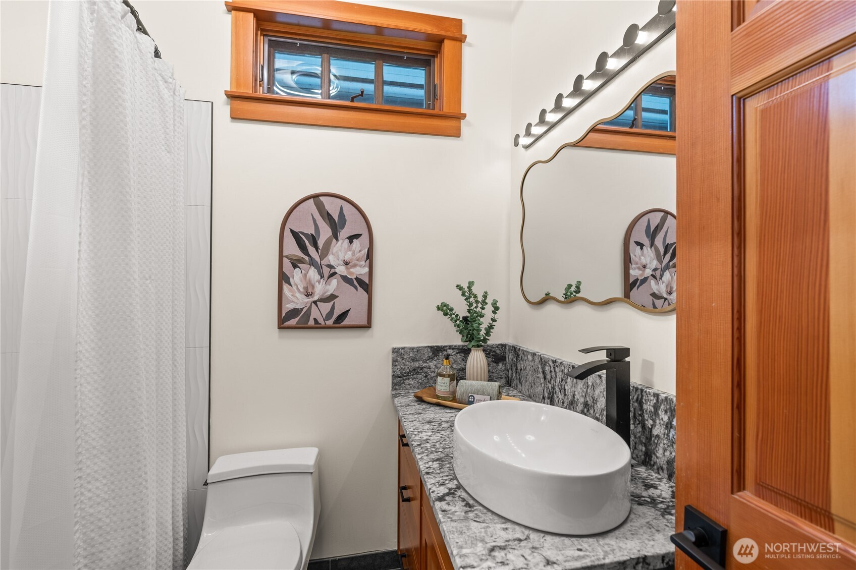 33244 Eglon Road Northeast Kingston, WA 98346 - Photo 18 of 40 a bathroom with a toilet a sink and mirror