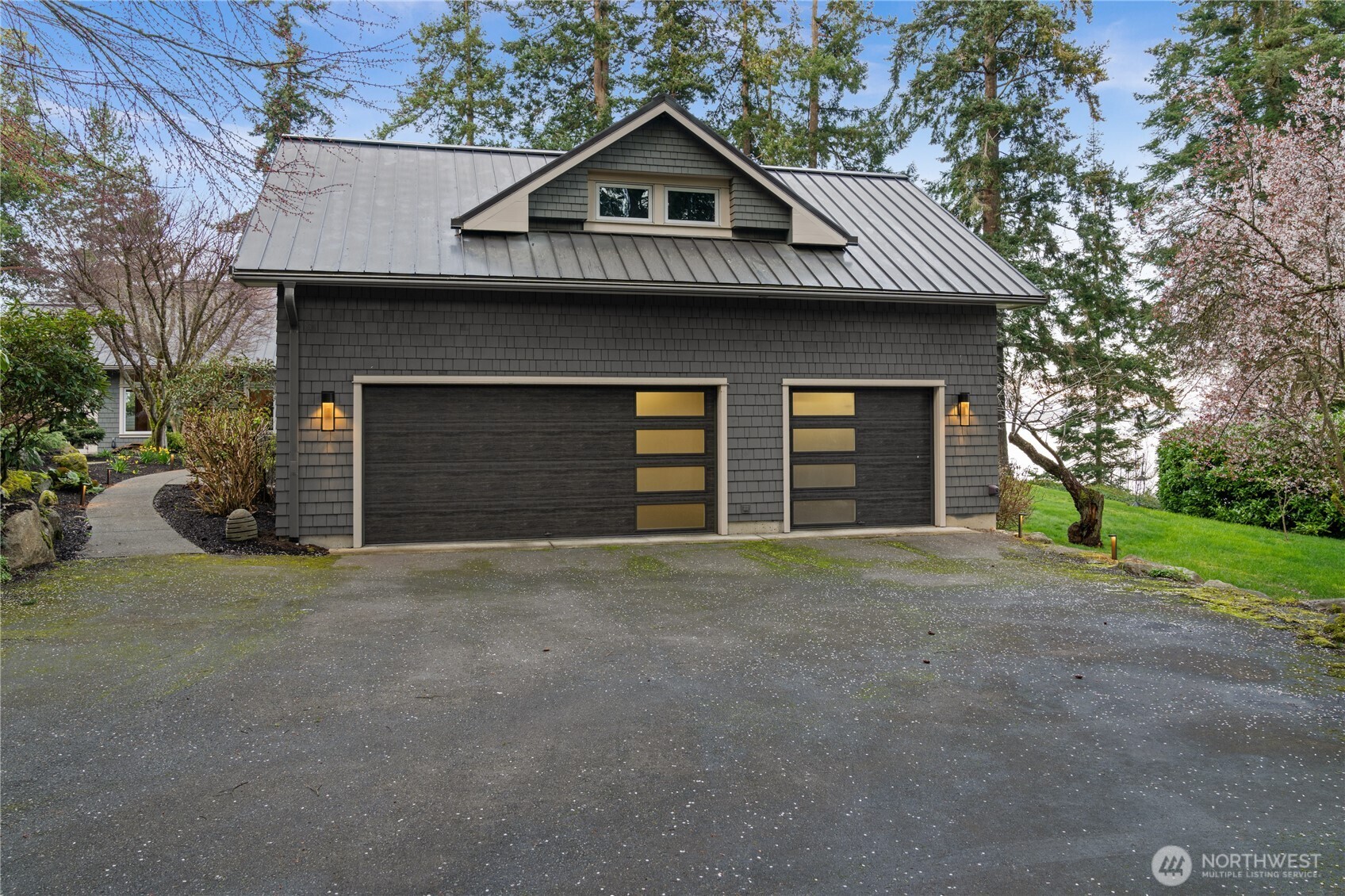 33244 Eglon Road Northeast Kingston, WA 98346 - Photo 26 of 40 a front view of a house with a yard and garage