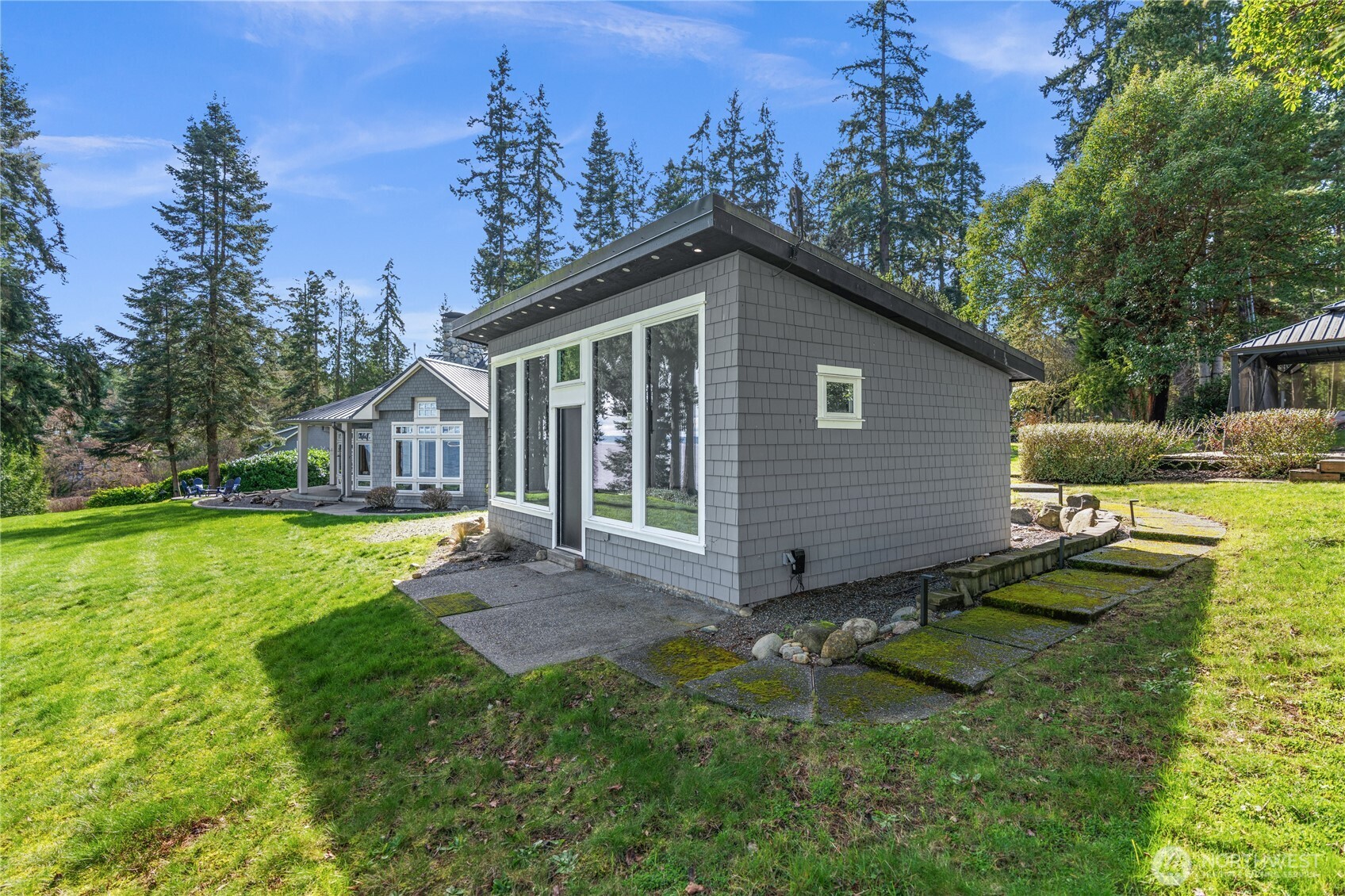33244 Eglon Road Northeast Kingston, WA 98346 - Photo 28 of 40 a view of a house with yard and sitting area