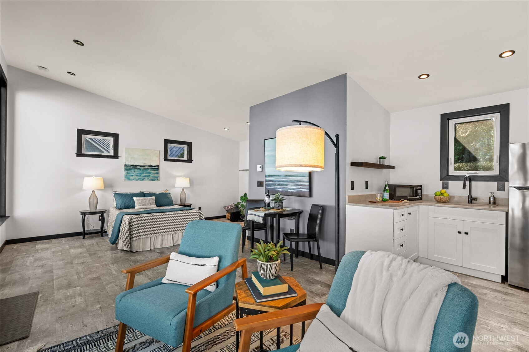 33244 Eglon Road Northeast Kingston, WA 98346 - Photo 29 of 40 a living room with furniture a dining table and kitchen view