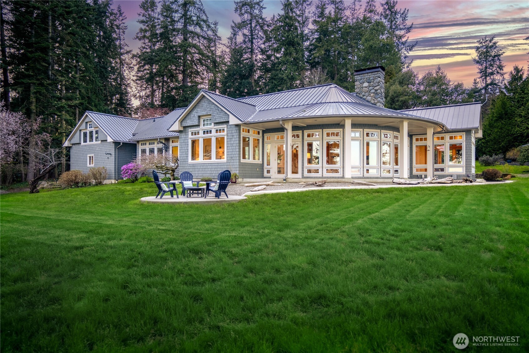 33244 Eglon Road Northeast Kingston, WA 98346 - Photo 3 of 40 a front view of a house with a garden