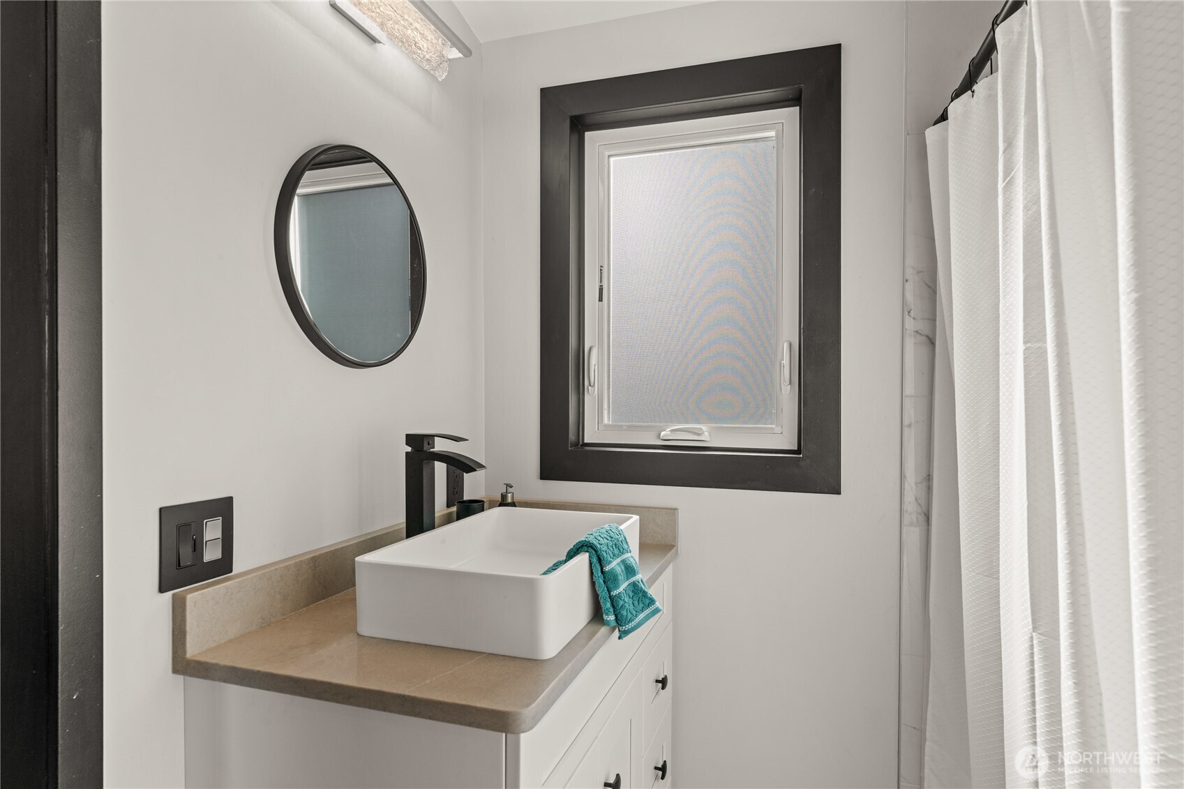 33244 Eglon Road Northeast Kingston, WA 98346 - Photo 31 of 40 a bathroom with a sink and a mirror