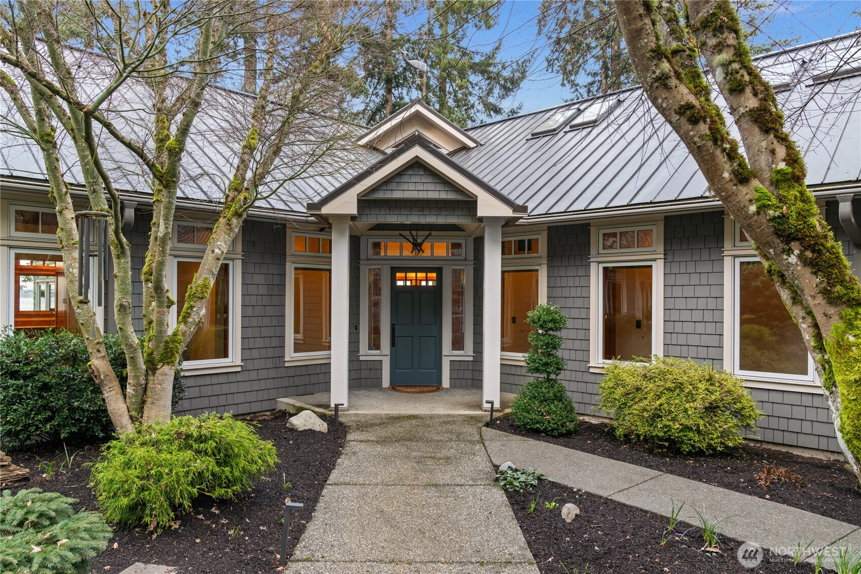 33244 Eglon Road Northeast Kingston, WA 98346 - Photo 5 of 40 front view of a brick house with a small yard