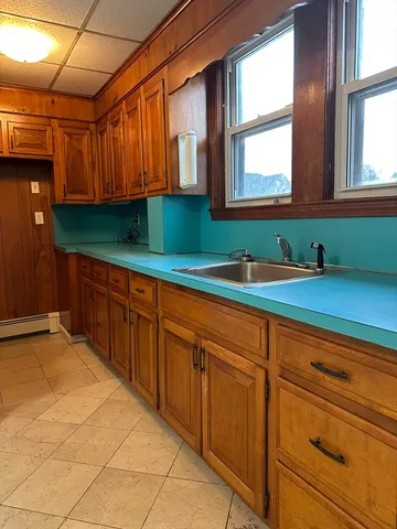 a kitchen with sink and window