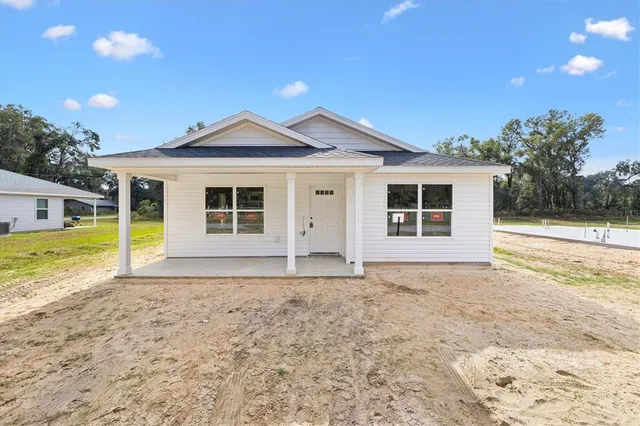 a view of house with backyard and outdoor space
