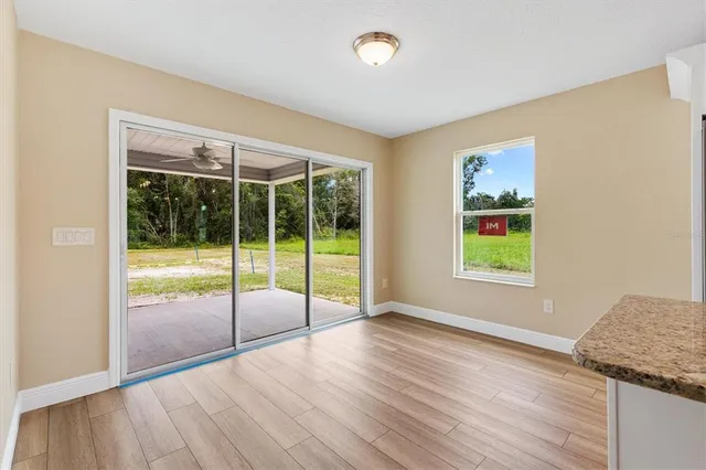 a view of an empty room with glass door