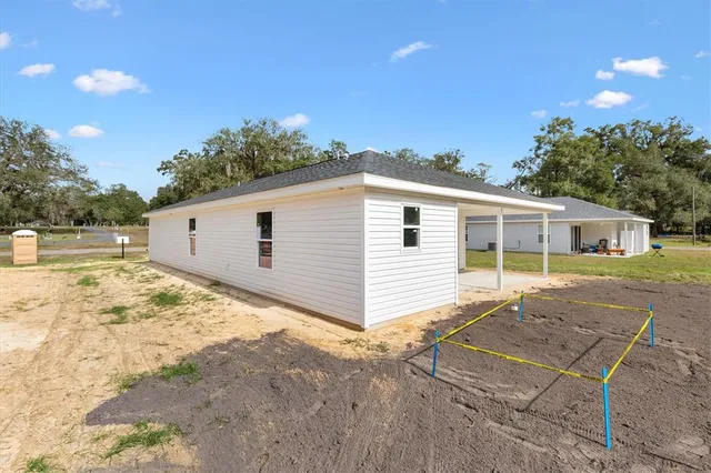 a view of a backyard of the house