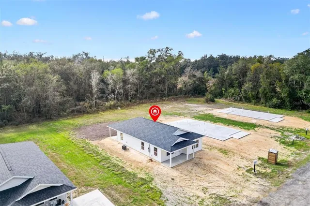 swimming pool view with a backyard space