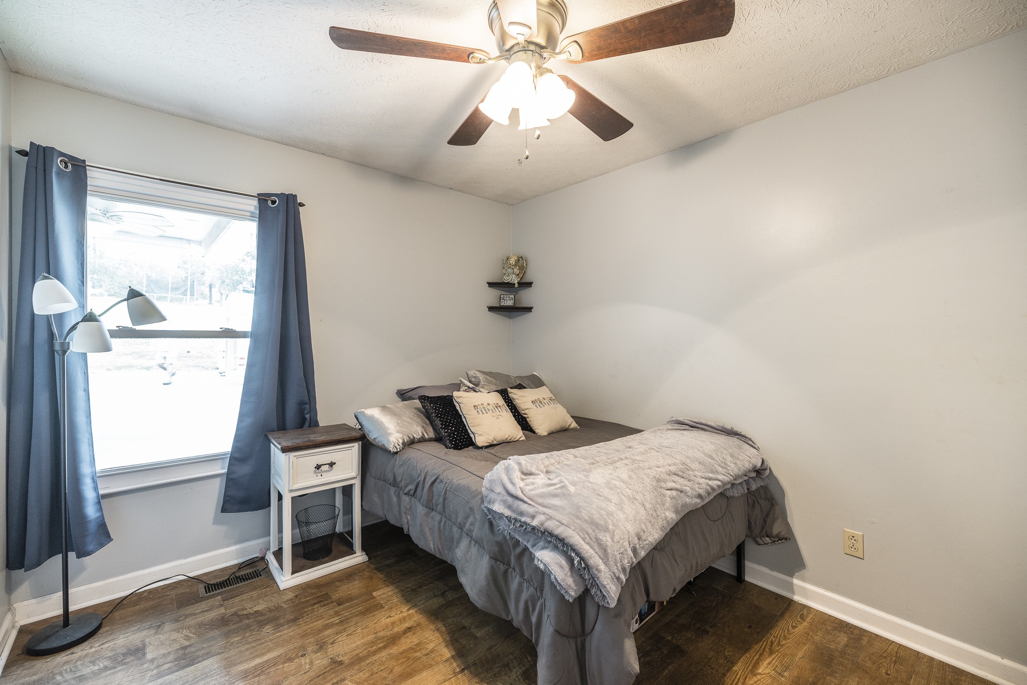 3000 Tom Austin Highway Springfield, TN 37172 - Photo 21 of 32 a bedroom with a bed and a chandelier