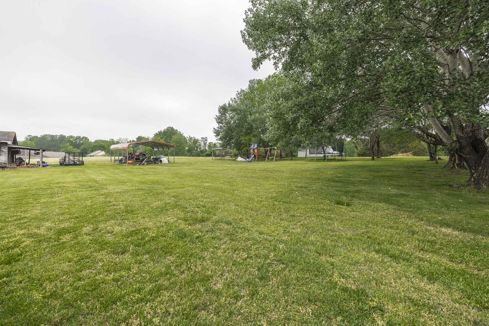 3000 Tom Austin Highway Springfield, TN 37172 - Photo 27 of 32 a view of a green field with wooden fence
