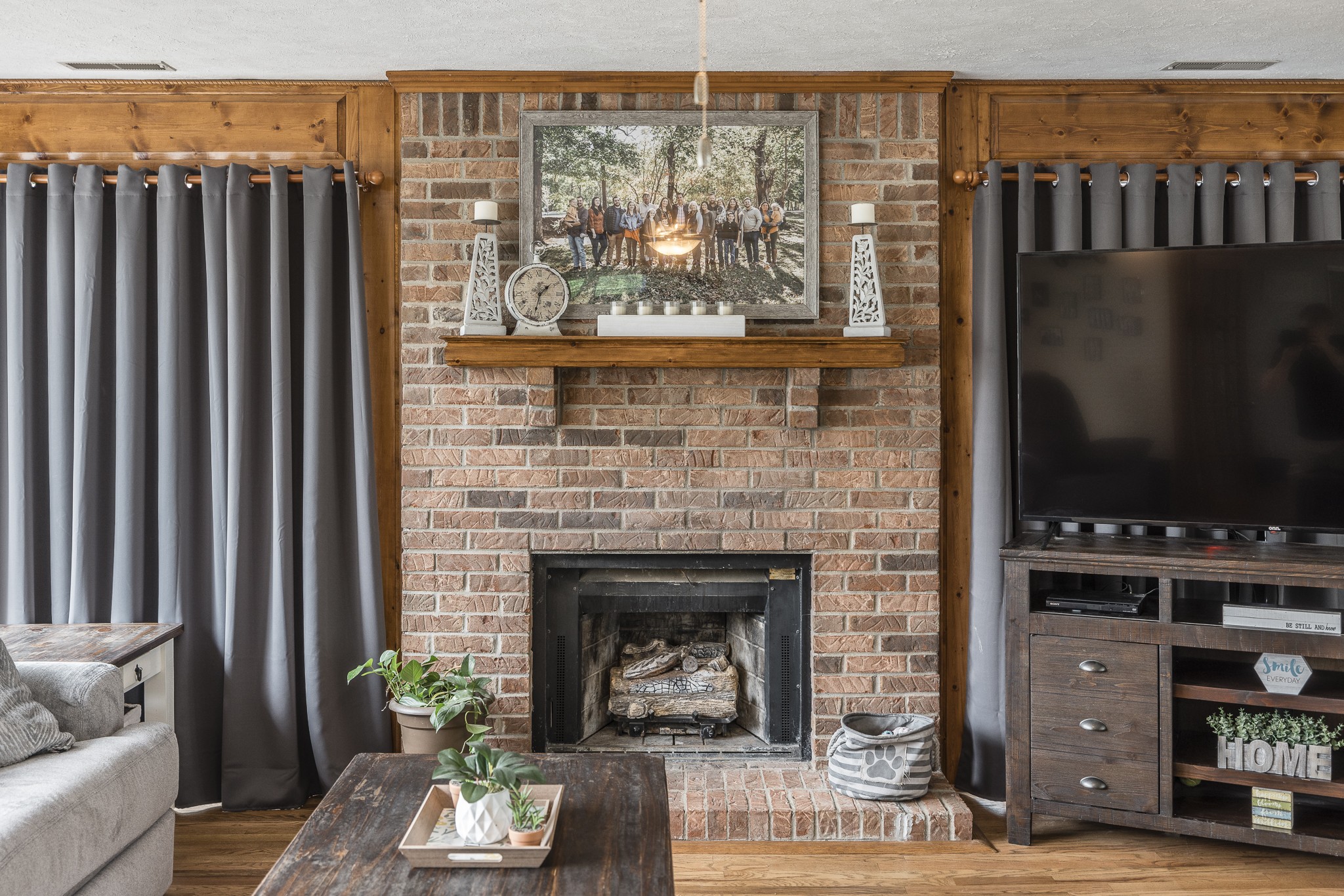 3000 Tom Austin Highway Springfield, TN 37172 - Photo 8 of 32 a living room with furniture a fireplace and a flat screen tv