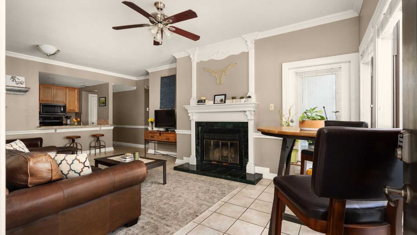 a living room with furniture and a fireplace