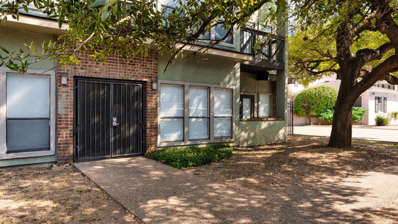 807 West 25th Street, Unit 207 Austin, TX 78705 - Photo 22 of 25 a front view of a house with a yard