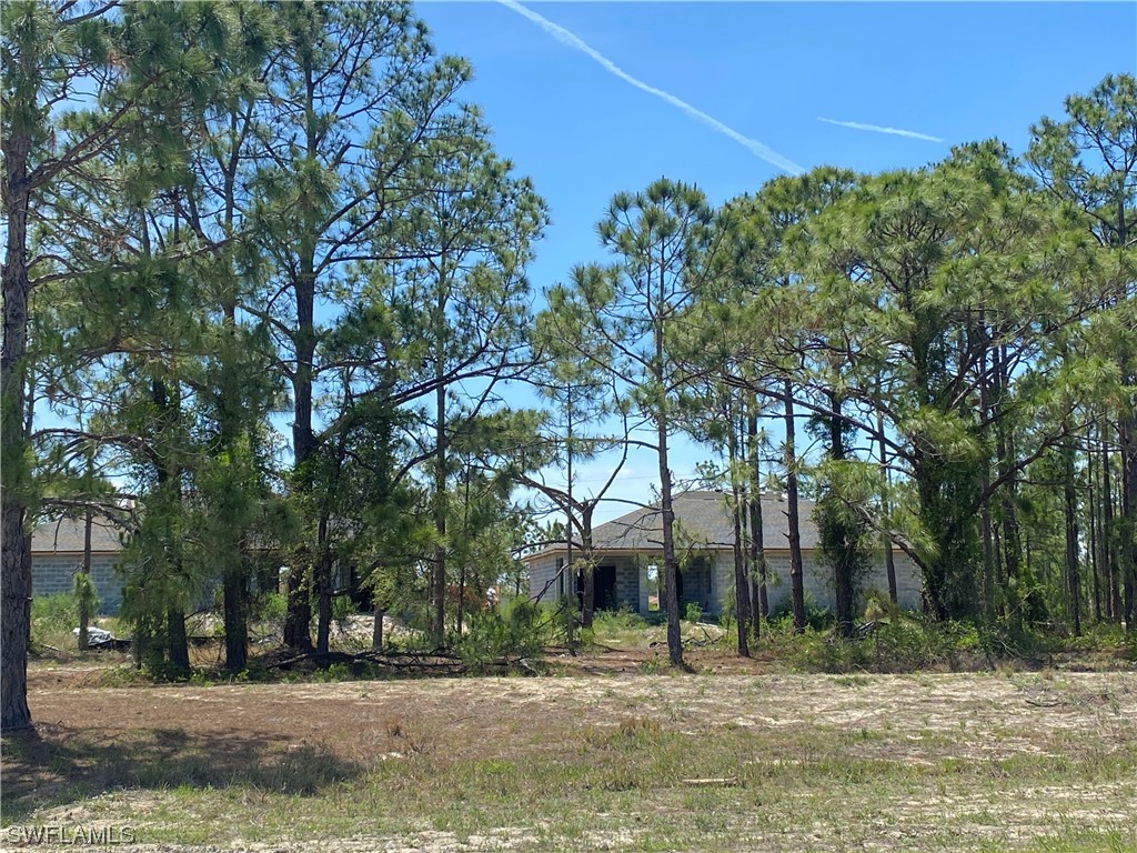 758 Homestead Road South Lehigh Acres, FL 33974 - Photo 1 of 7 a outdoor space with lots of trees
